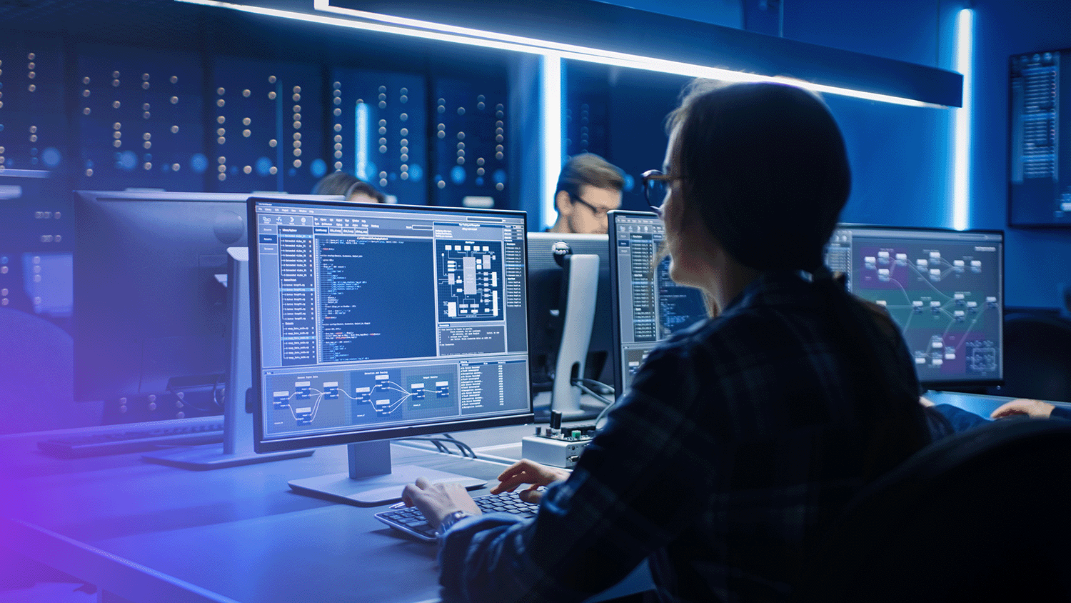 woman working on computer showing data on screen